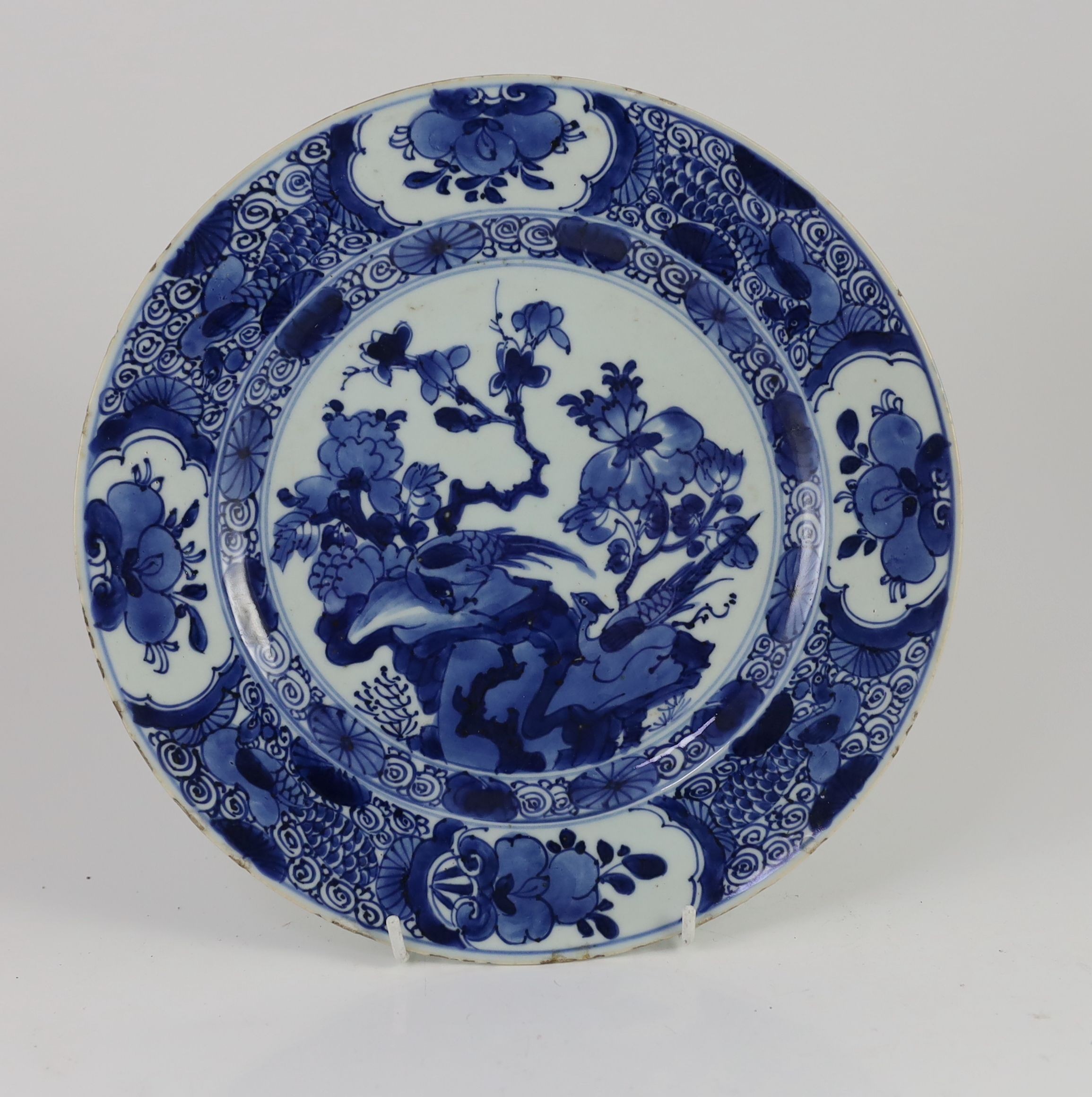 A set of three Chinese blue and white ‘pheasant’ large plates, Kangxi period, 28cm diameter, one repaired